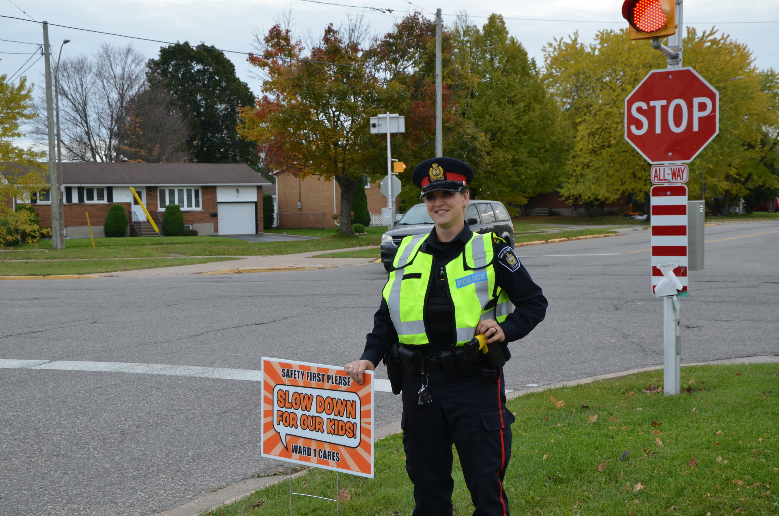 Officer with slow down sign